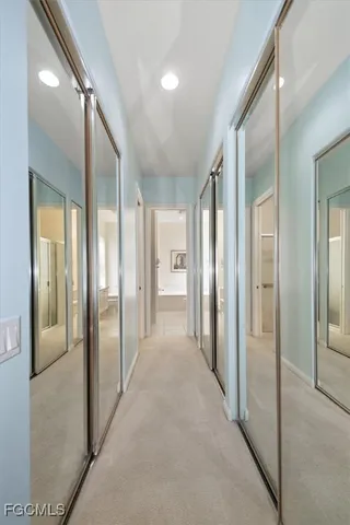 a spacious bathroom with a granite countertop toilet a sink and a bathtub