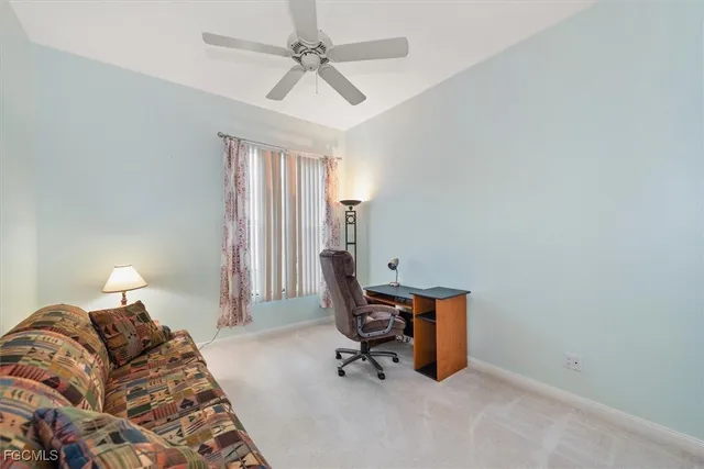 a bedroom with a bed and a mirror