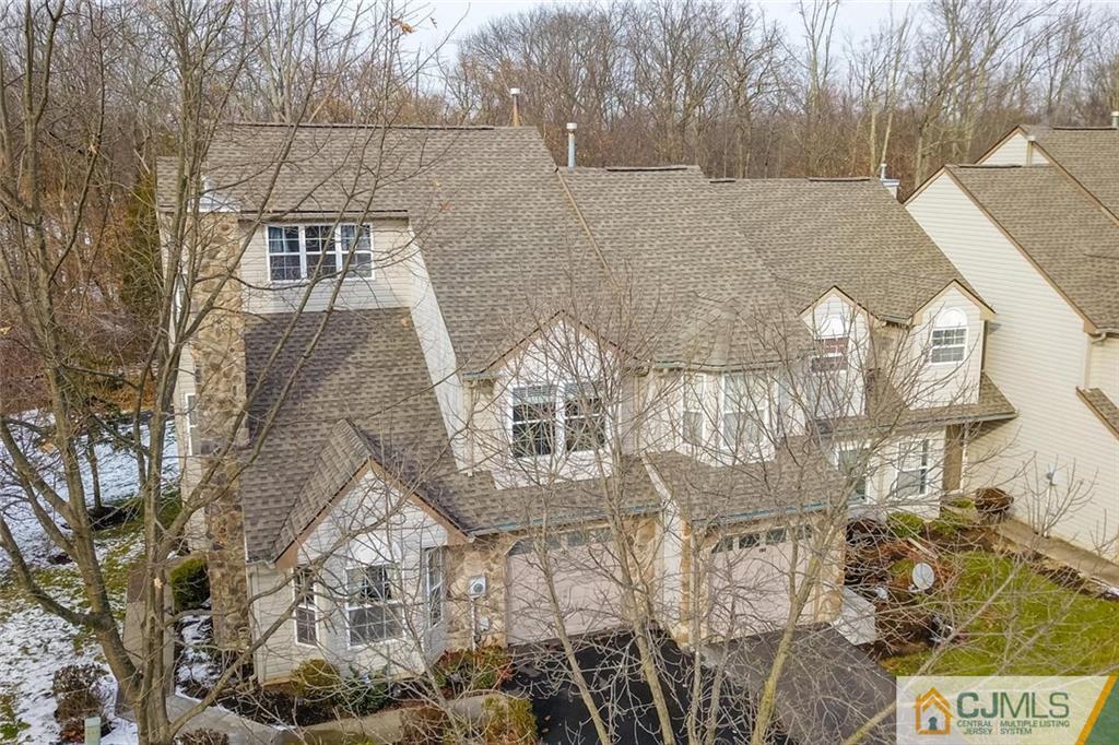 191 Nebula Road, Unit 191 Piscataway, NJ 08854 - Photo 1 of 24 a view of a brick house with a yard