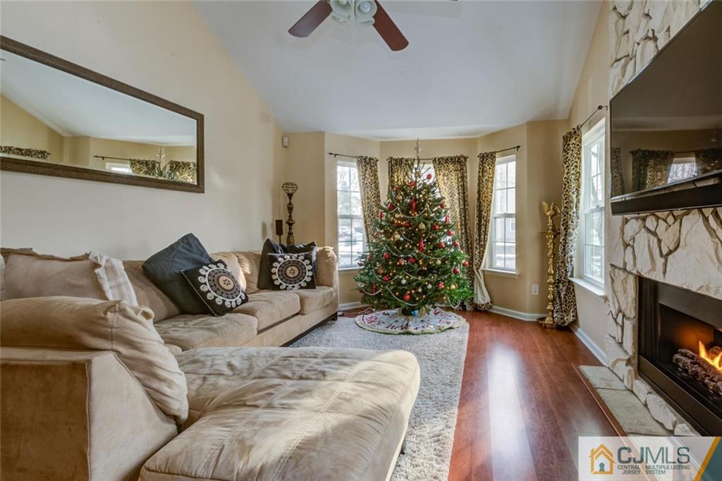 191 Nebula Road, Unit 191 Piscataway, NJ 08854 - Photo 2 of 24 a living room with furniture fireplace and flat screen tv