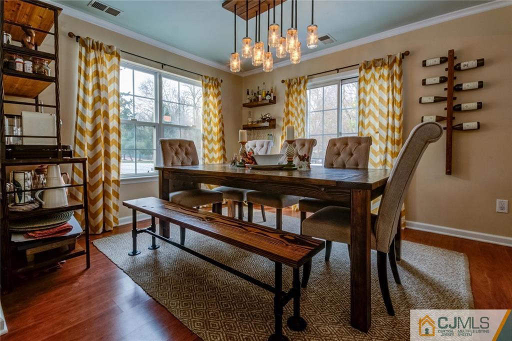 191 Nebula Road, Unit 191 Piscataway, NJ 08854 - Photo 7 of 24 a living room with furniture a chandelier and a flat screen tv