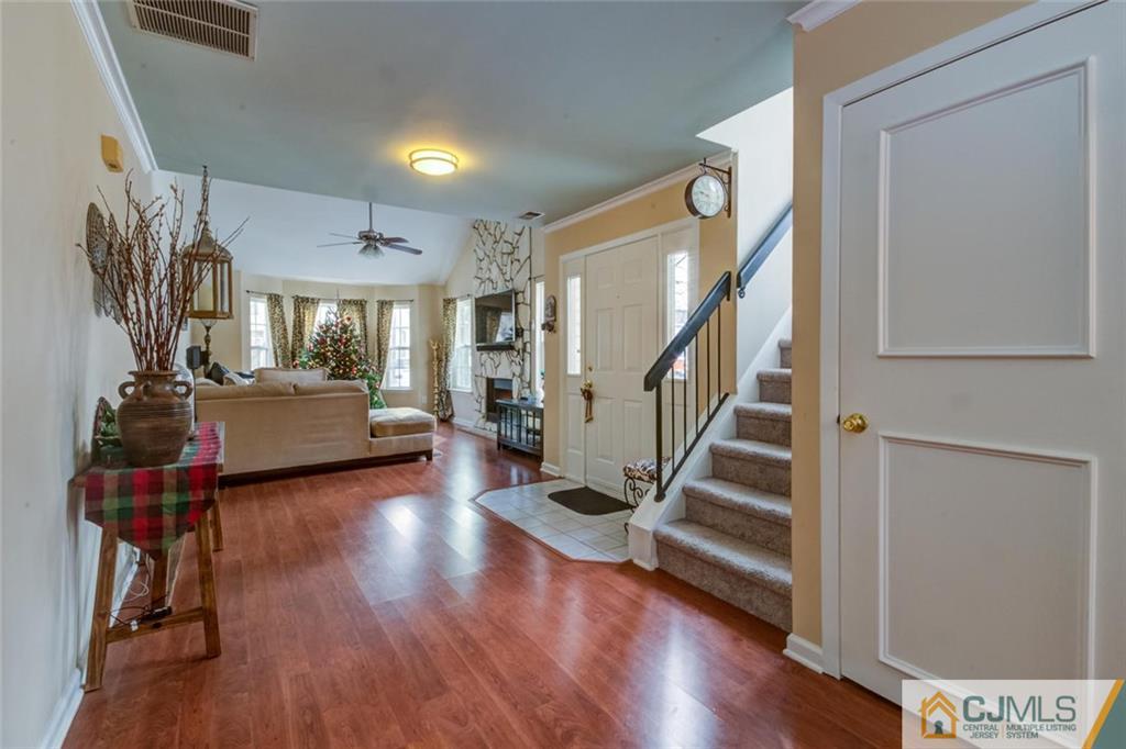 191 Nebula Road, Unit 191 Piscataway, NJ 08854 - Photo 8 of 24 a view of a room with wooden floor and stairs