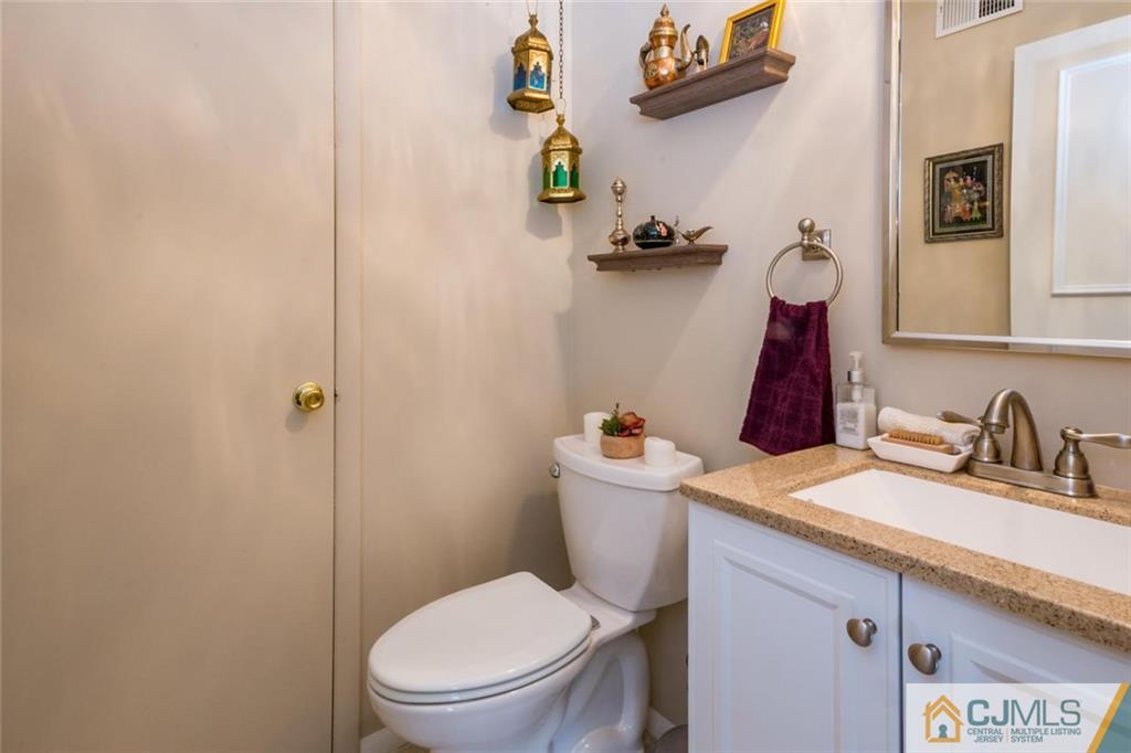 191 Nebula Road, Unit 191 Piscataway, NJ 08854 - Photo 10 of 24 a bathroom with a toilet and a sink