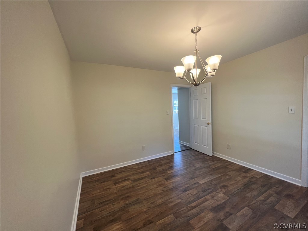 2525 Retrievers Ridge Road Richmond, VA 23233 - Photo 12 of 49 a view of a chandelier in big room with wooden floor