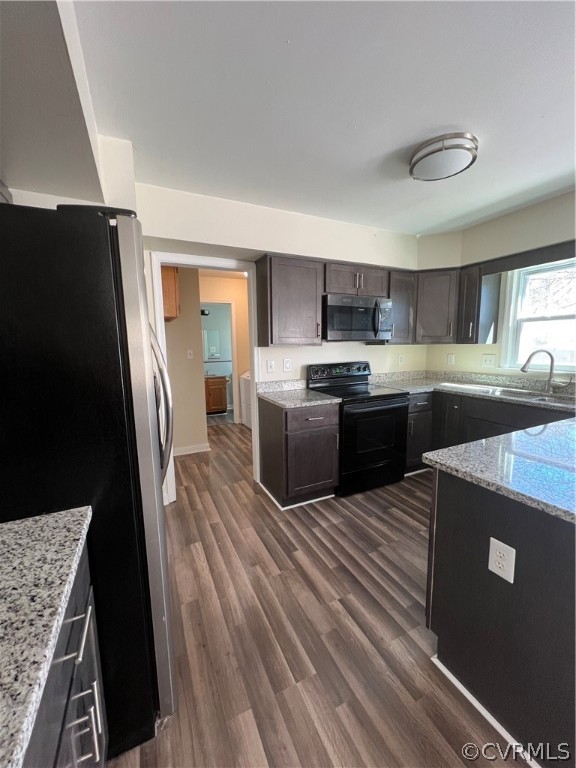 2525 Retrievers Ridge Road Richmond, VA 23233 - Photo 15 of 49 a kitchen with stainless steel appliances a sink a stove a refrigerator cabinets and a counter top space