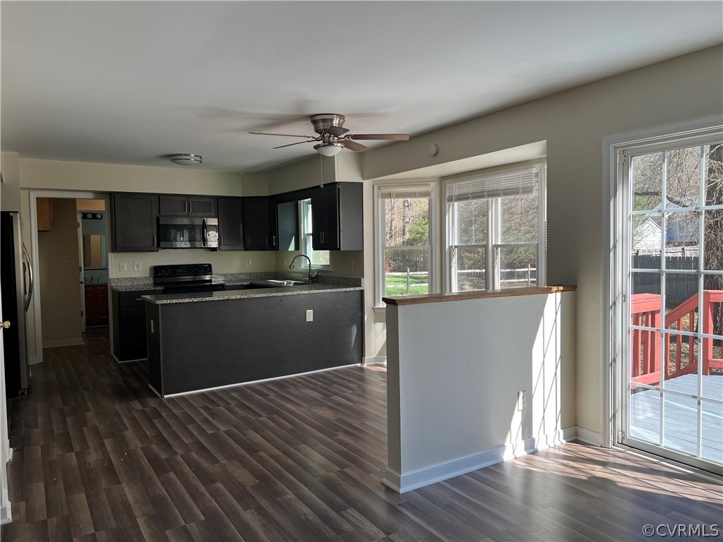 2525 Retrievers Ridge Road Richmond, VA 23233 - Photo 19 of 49 a kitchen with stainless steel appliances granite countertop a refrigerator and a stove top oven