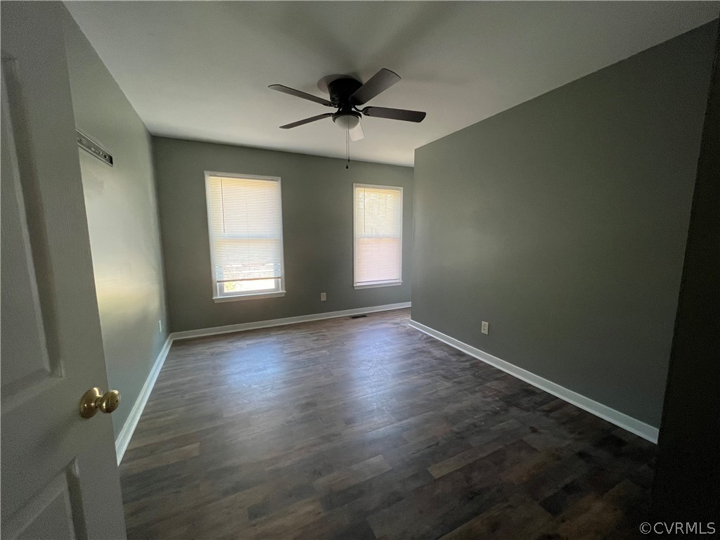 2525 Retrievers Ridge Road Richmond, VA 23233 - Photo 31 of 49 an empty room with wooden floor and windows