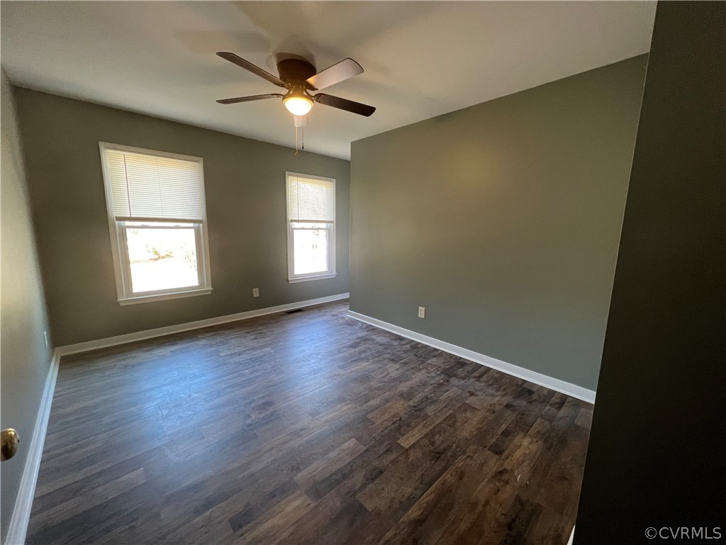 2525 Retrievers Ridge Road Richmond, VA 23233 - Photo 35 of 49 an empty room with wooden floor and windows