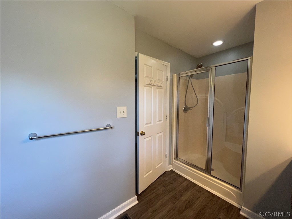 2525 Retrievers Ridge Road Richmond, VA 23233 - Photo 39 of 49 a bathroom with a glass shower door