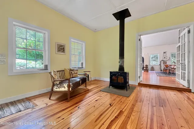 a open kitchen with a sink dining table and chairs