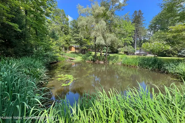 a backyard of a house with a lake view