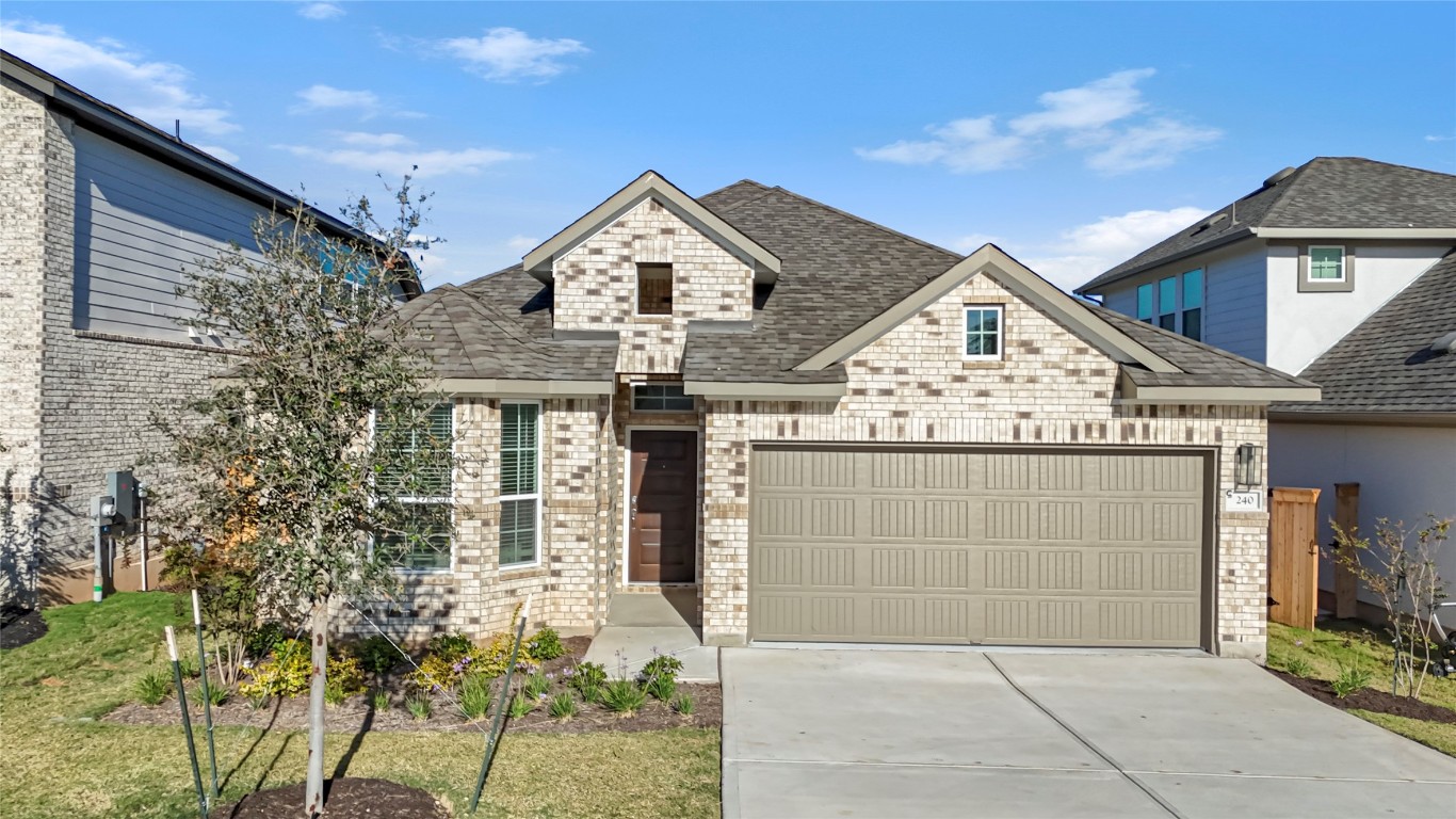 240 Wingstem Way Georgetown, TX 78633 - Photo 1 of 1 a front view of a house with a yard
