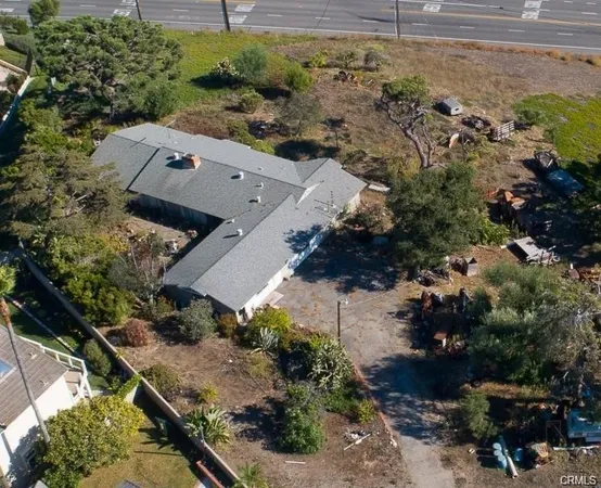 an aerial view of residential house with outdoor space