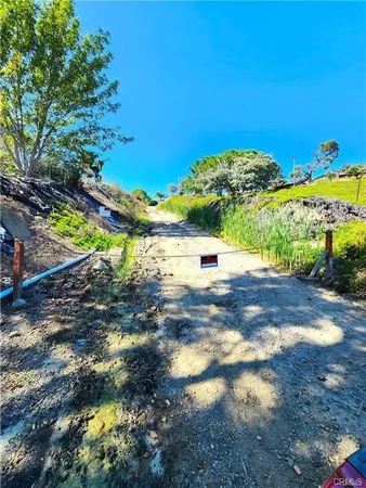 a view of a yard with an ocean