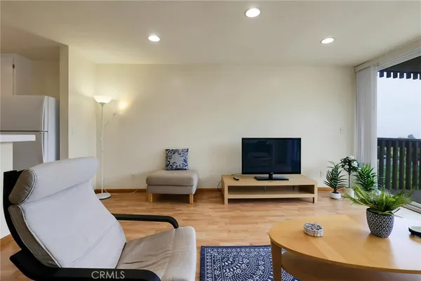 a view of car parked on road with parking space