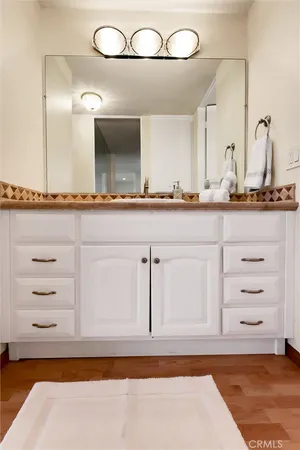 a bedroom with a bed and a lamp on table