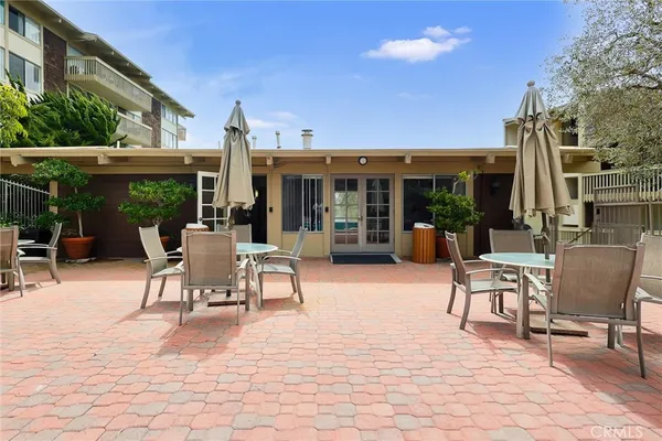 a view of a city with lush green forest