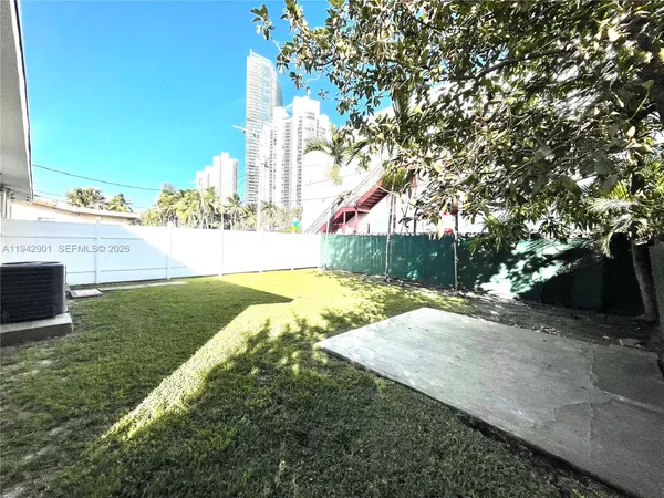 a view of a yard with an trees