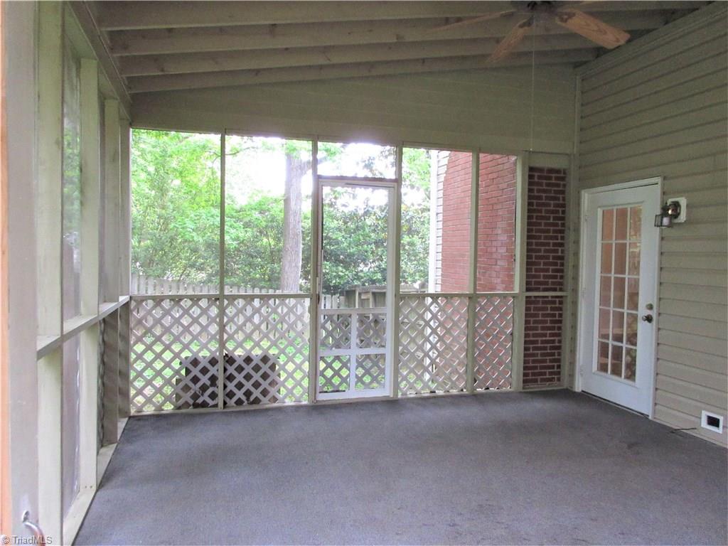 315 Canterbury Road High Point, NC 27262 - Photo 17 of 18 Screen Porch goes to fenced portion of backyard. Patio on the other side.