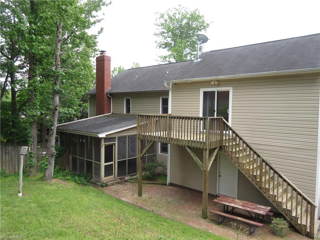 315 Canterbury Road High Point, NC 27262 - Photo 18 of 18 Rear view shows the screen porch, patio area and the deck that goes to the Bonus Room.