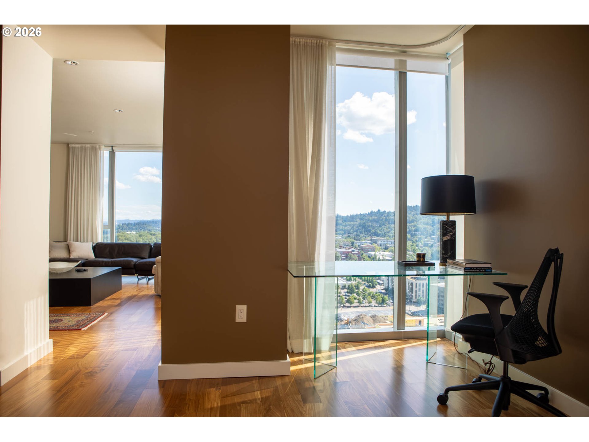 841 Southwest Gaines Street, Unit 2012 Portland, OR 97239 - Photo 11 of 44 a living room with furniture and a window