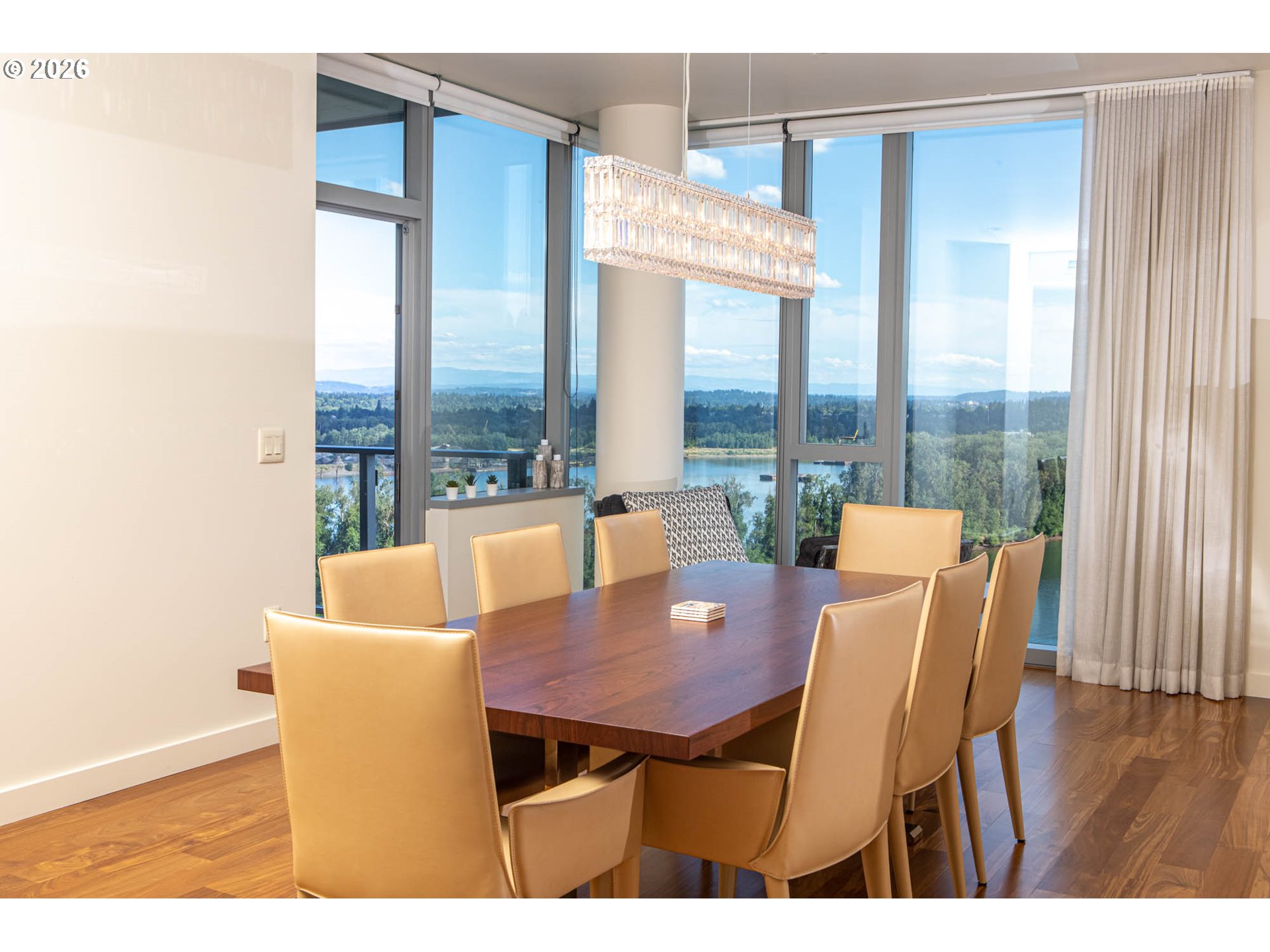 841 Southwest Gaines Street, Unit 2012 Portland, OR 97239 - Photo 13 of 44 a view of a dining room with furniture window and wooden floor