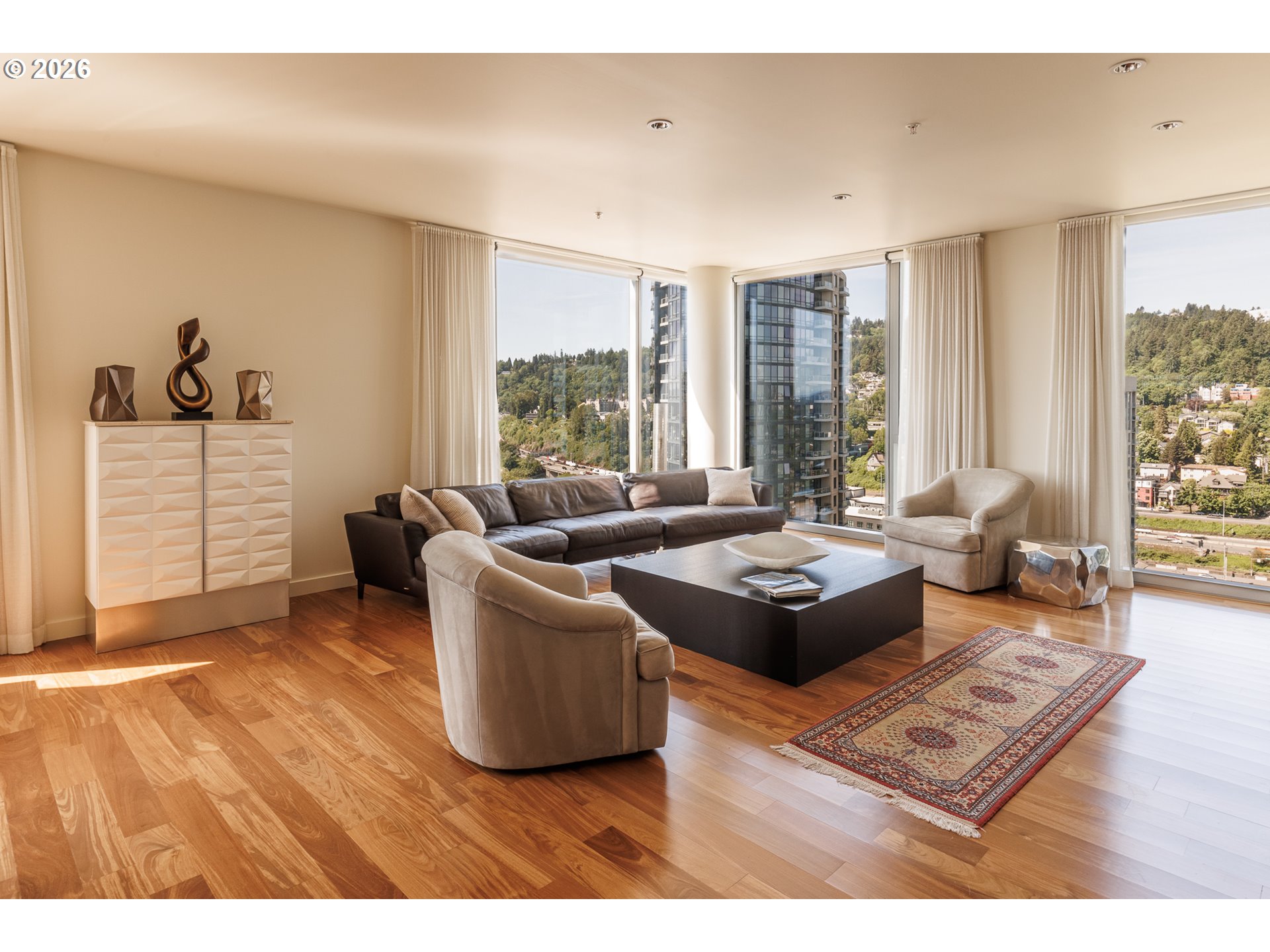 841 Southwest Gaines Street, Unit 2012 Portland, OR 97239 - Photo 15 of 44 a living room with furniture and a large window
