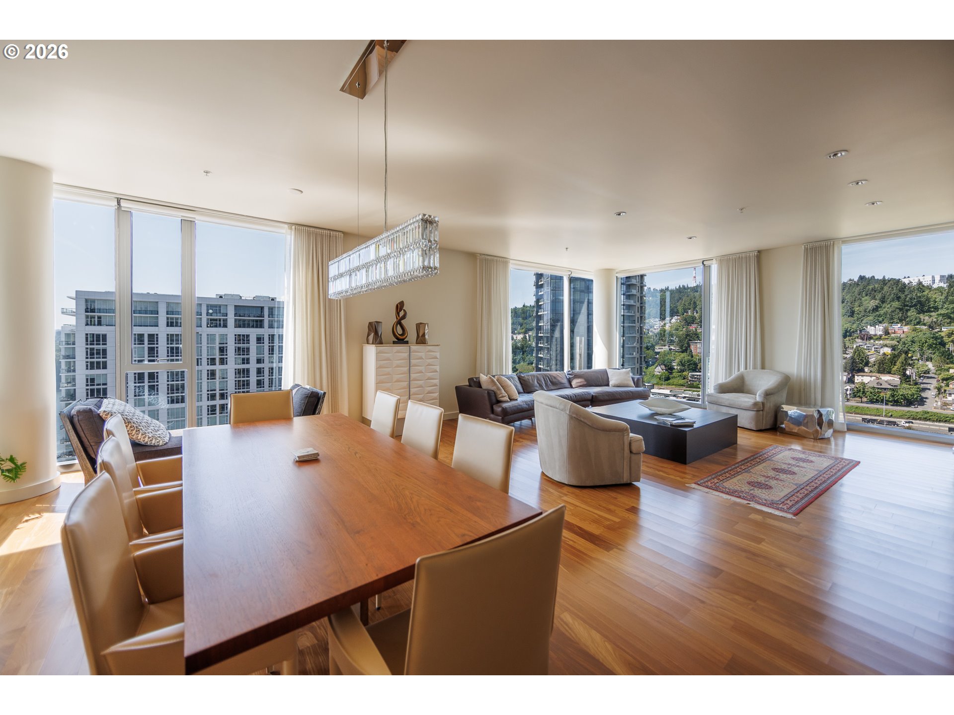 841 Southwest Gaines Street, Unit 2012 Portland, OR 97239 - Photo 16 of 44 a view of a dining room with furniture and wooden floor