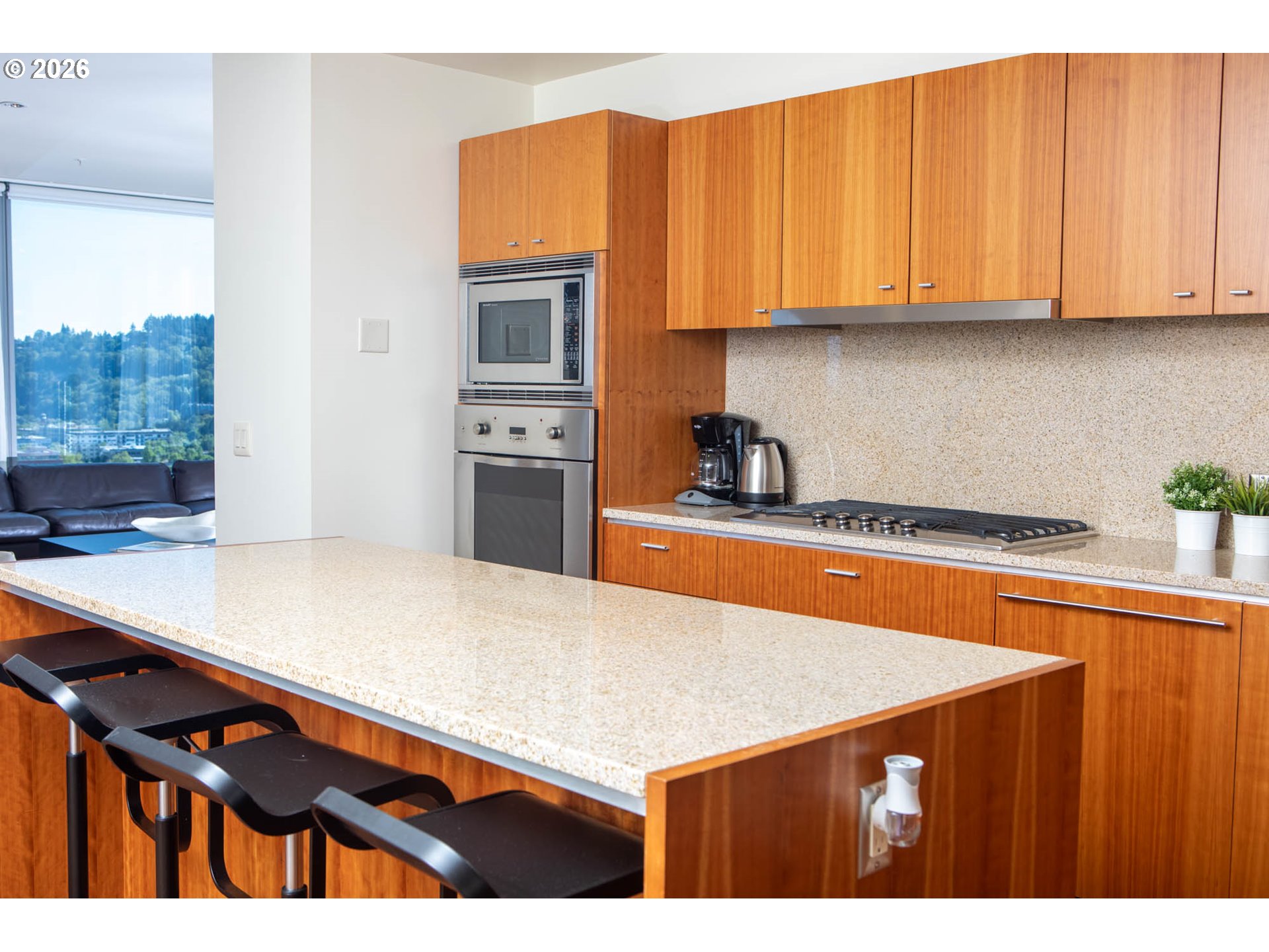 841 Southwest Gaines Street, Unit 2012 Portland, OR 97239 - Photo 19 of 44 a kitchen with stainless steel appliances a sink dishwasher stove refrigerator and cabinets
