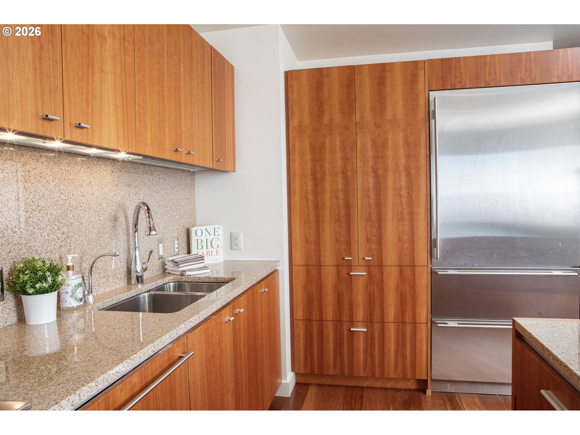 841 Southwest Gaines Street, Unit 2012 Portland, OR 97239 - Photo 20 of 44 a kitchen with stainless steel appliances granite countertop a sink and cabinets
