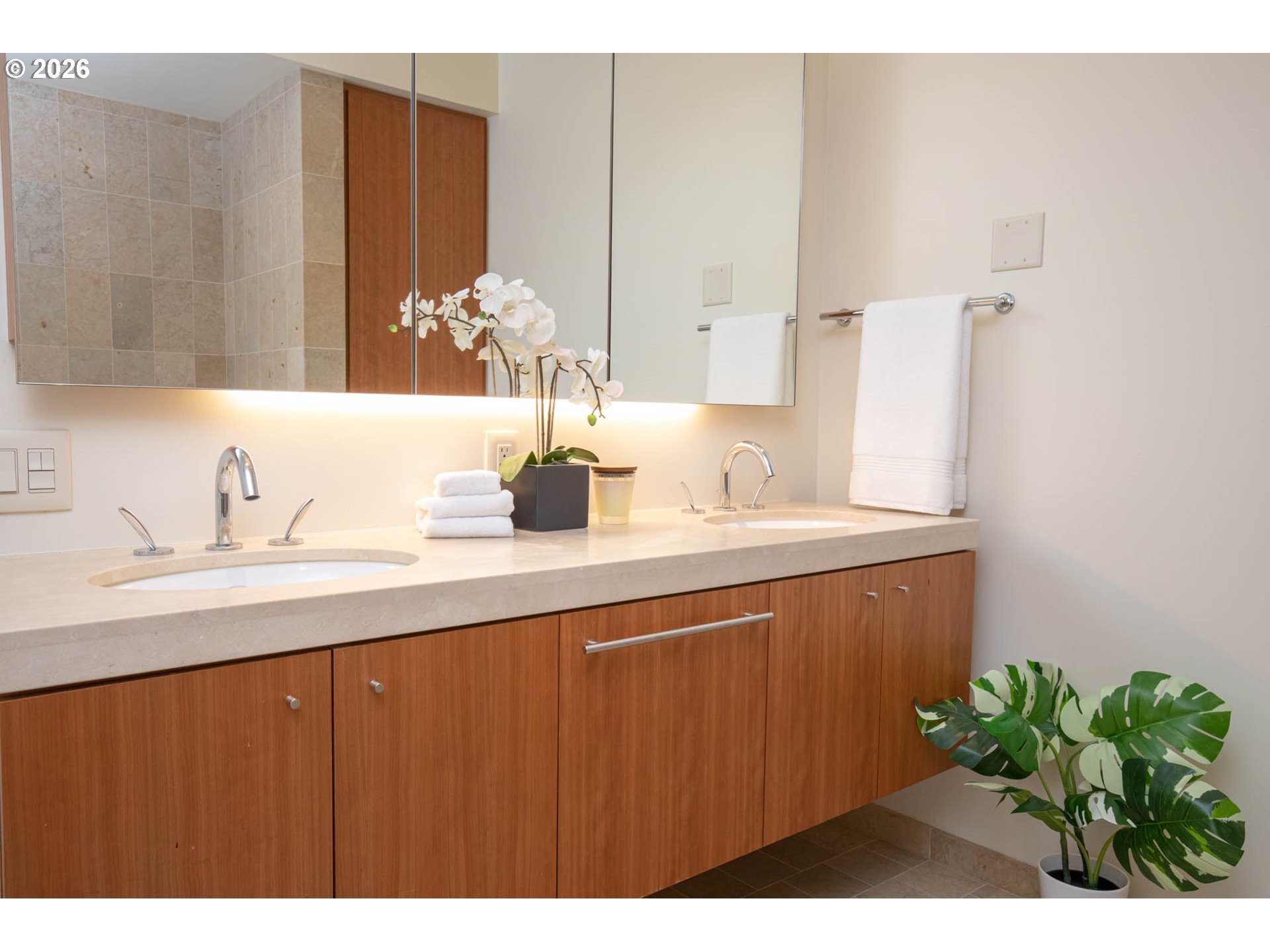 841 Southwest Gaines Street, Unit 2012 Portland, OR 97239 - Photo 25 of 44 a bathroom with a sink and a mirror
