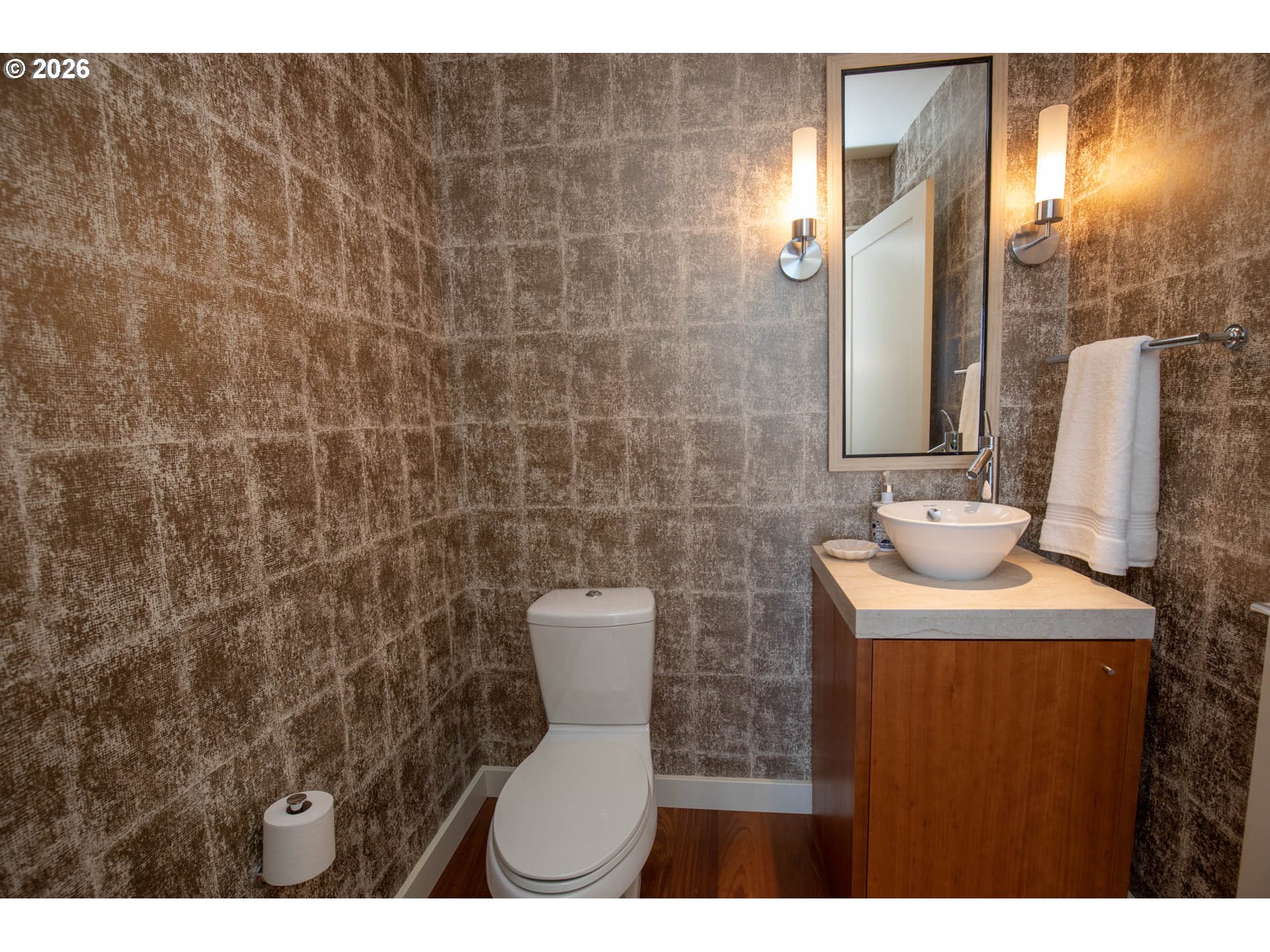 841 Southwest Gaines Street, Unit 2012 Portland, OR 97239 - Photo 28 of 44 a bathroom with a toilet a sink and mirror