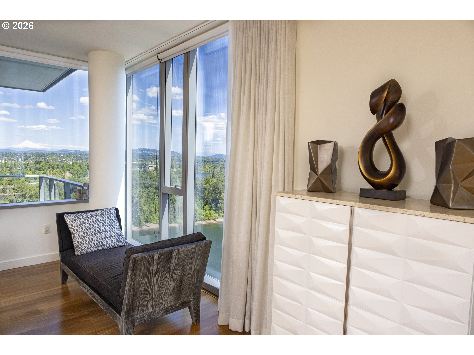 841 Southwest Gaines Street, Unit 2012 Portland, OR 97239 - Photo 30 of 44 a view of a room that has a bed and a window