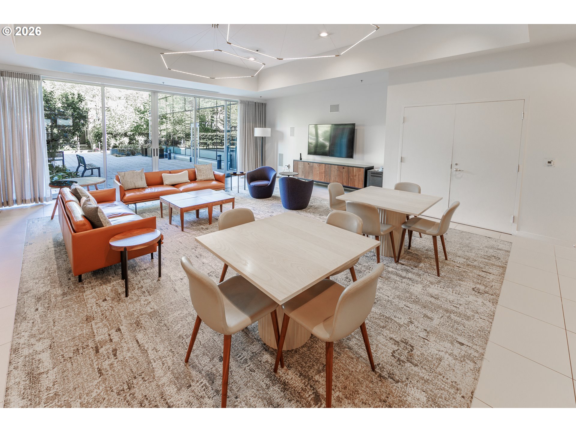 841 Southwest Gaines Street, Unit 2012 Portland, OR 97239 - Photo 31 of 44 a outdoor dining space with furniture and a potted plant