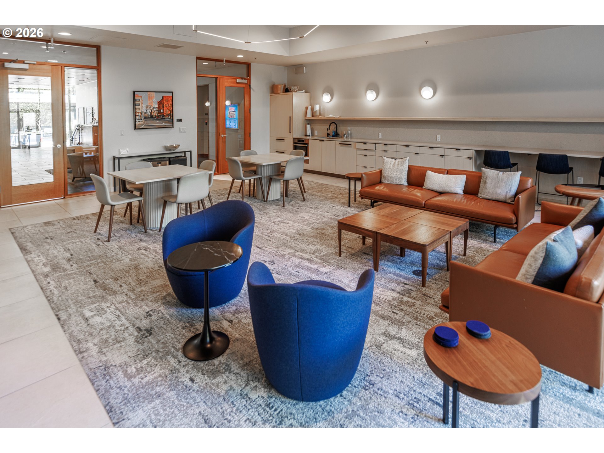 841 Southwest Gaines Street, Unit 2012 Portland, OR 97239 - Photo 32 of 44 a living room with lots of furniture and a rug