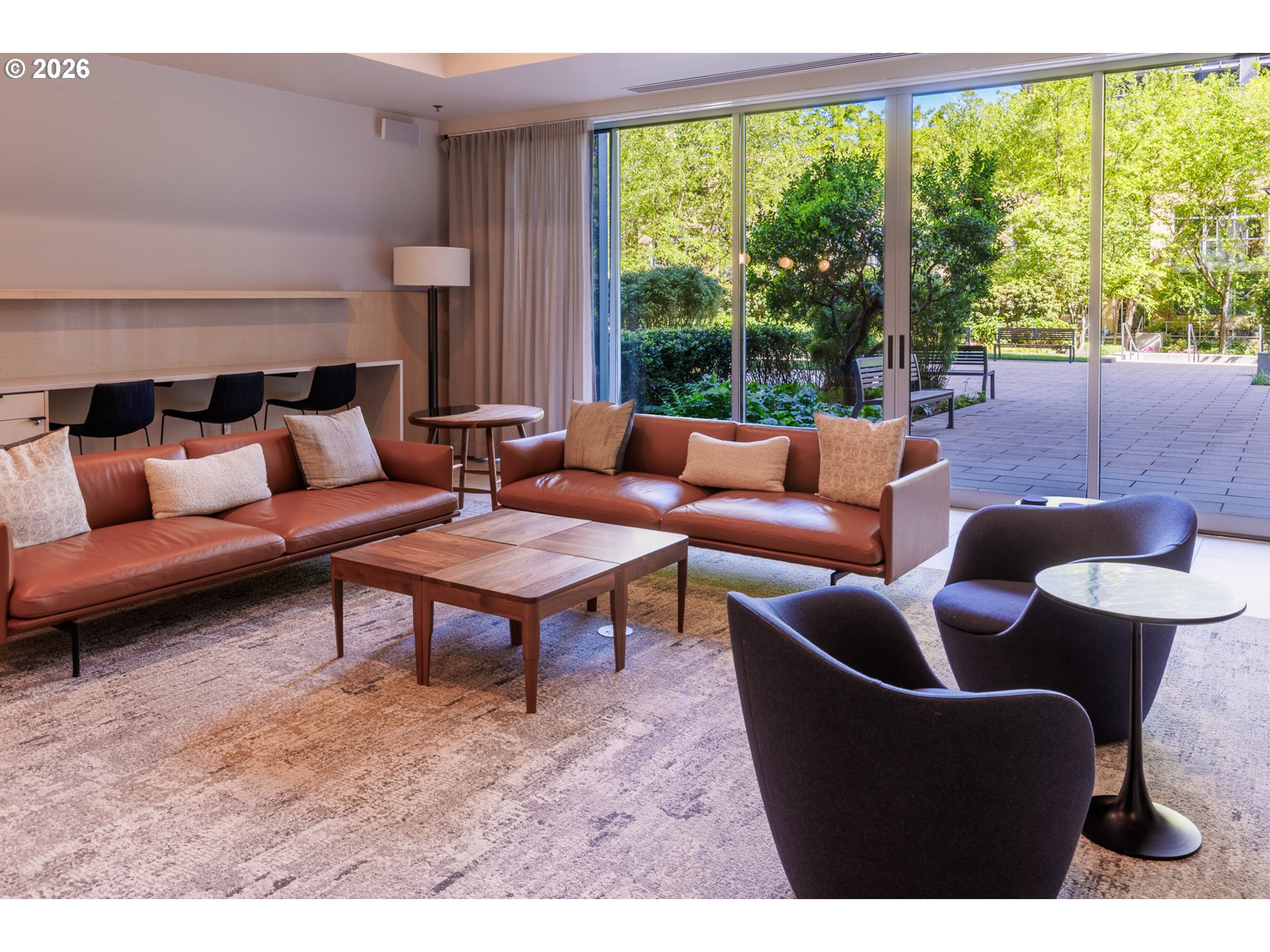 841 Southwest Gaines Street, Unit 2012 Portland, OR 97239 - Photo 33 of 44 a living room with furniture and a large window