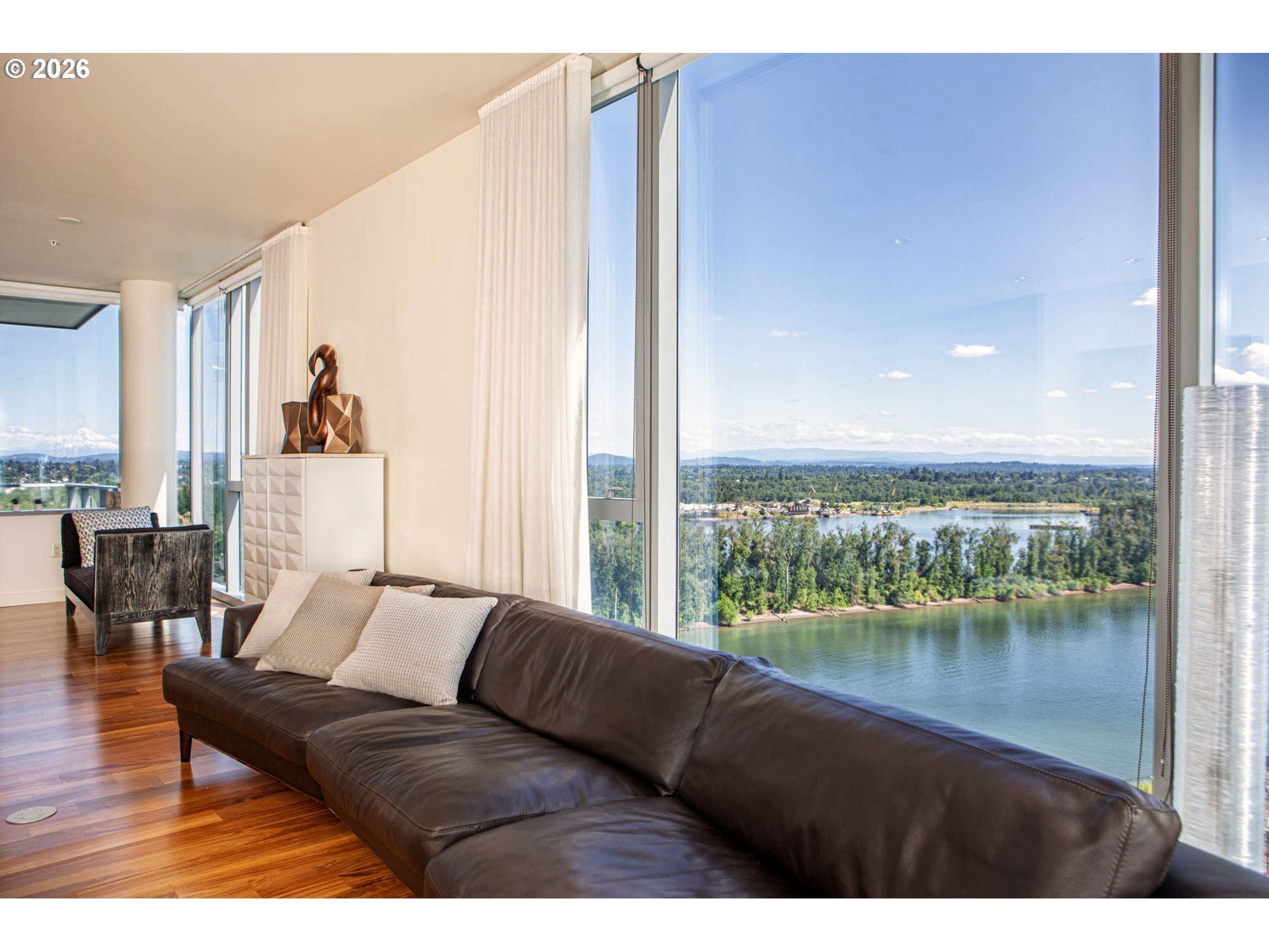 841 Southwest Gaines Street, Unit 2012 Portland, OR 97239 - Photo 5 of 44 a living room with furniture and a large window