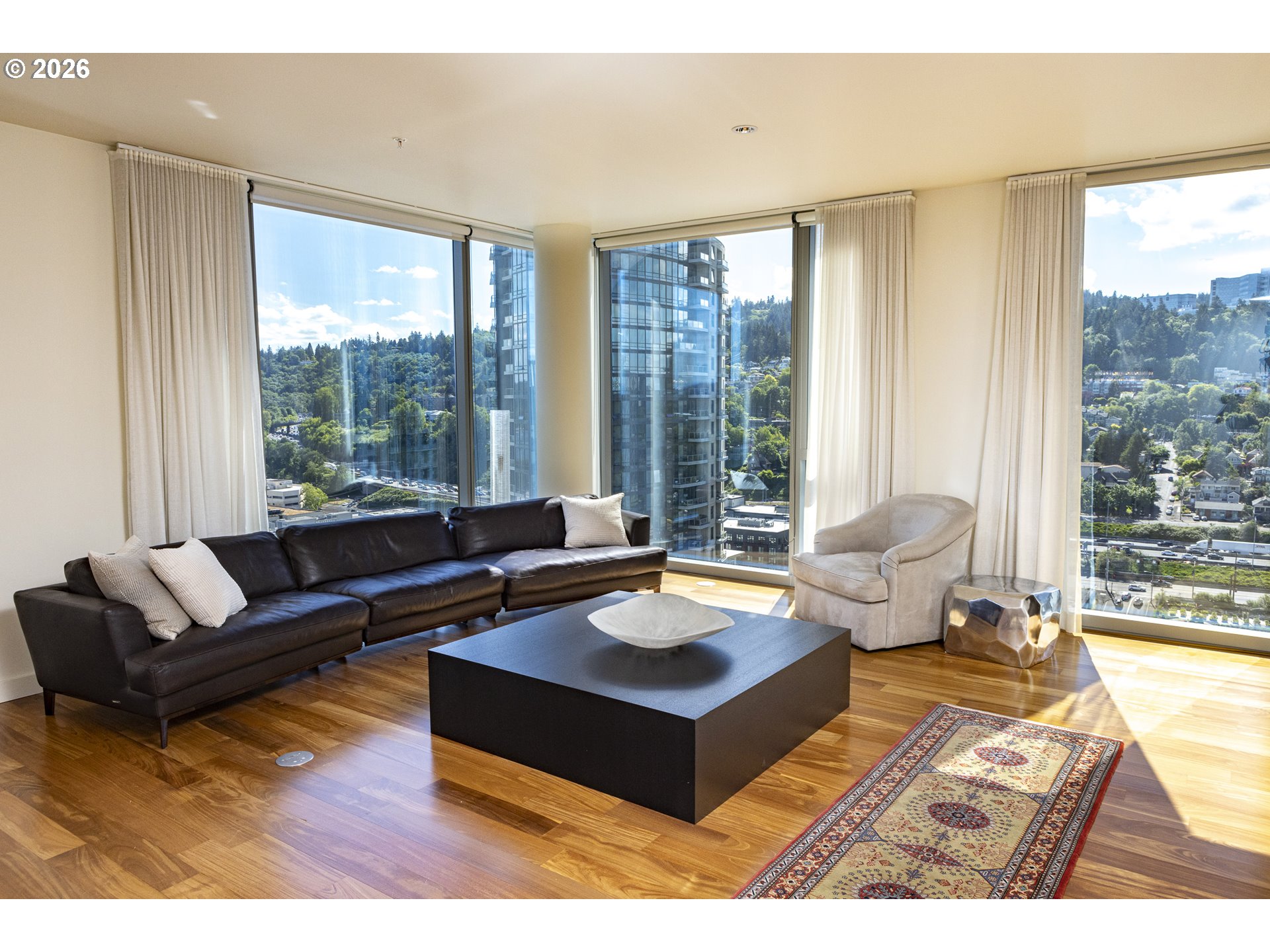 841 Southwest Gaines Street, Unit 2012 Portland, OR 97239 - Photo 6 of 44 a living room with furniture and a large window