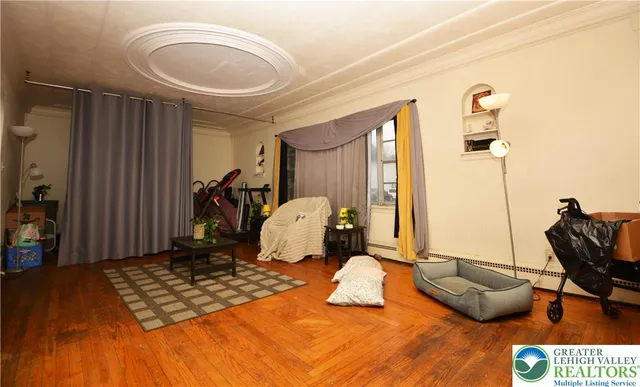 a bedroom with furniture and a window