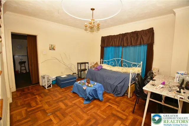 a bedroom with a bed and a mirror