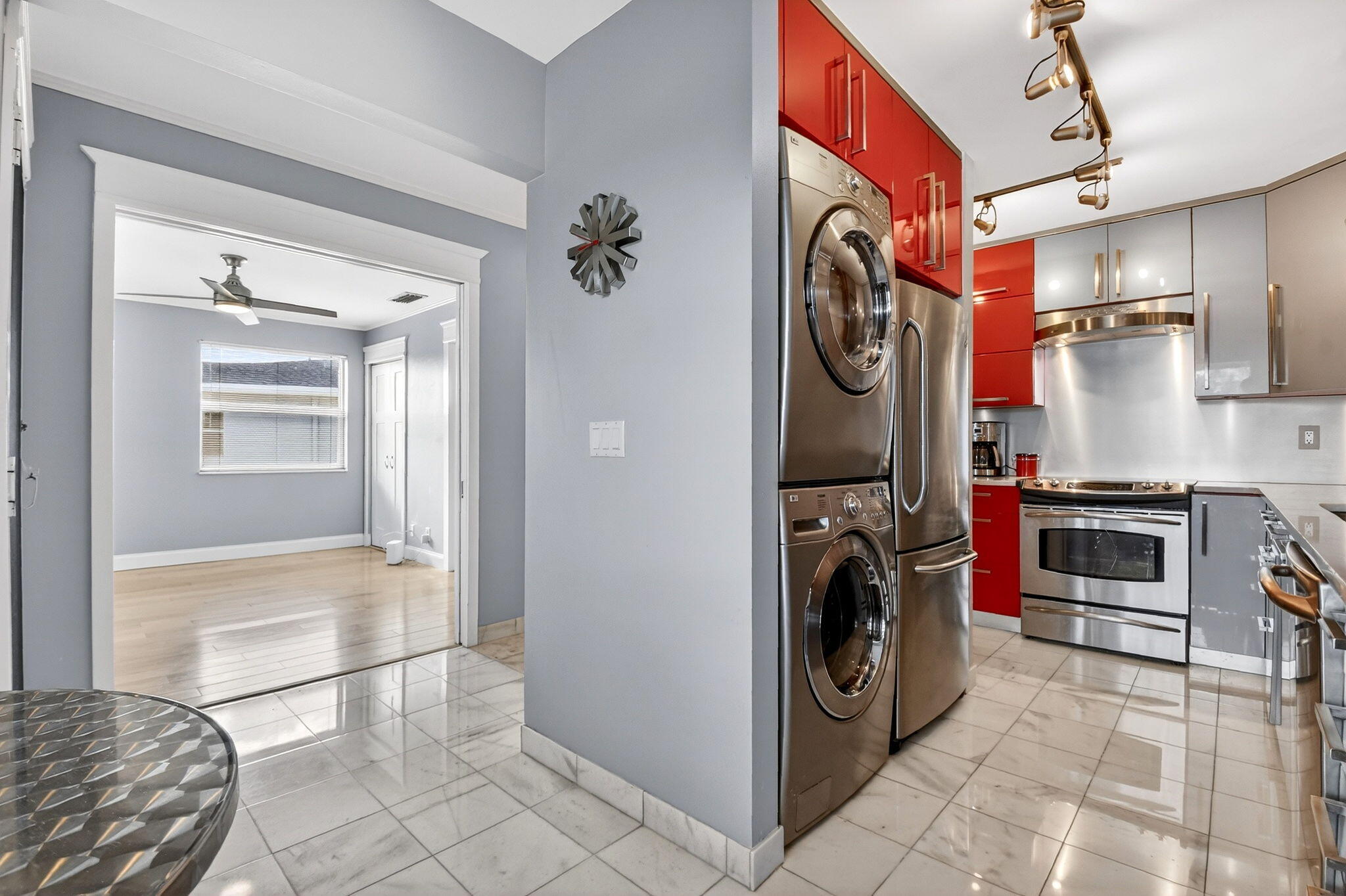 1411 Southwest 27th Avenue, Unit 201 Delray Beach, FL 33445 - Photo 13 of 48 a view of a storage & utility room with washer and dryer