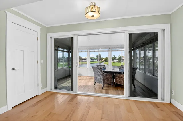 a aerial view of a house with swimming pool and a yard