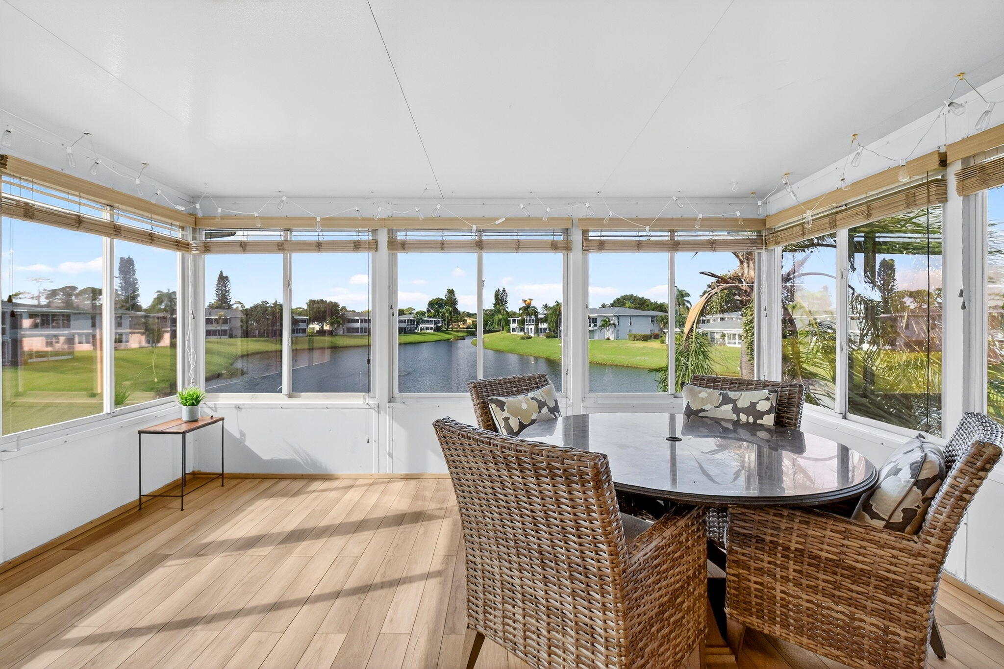1411 Southwest 27th Avenue, Unit 201 Delray Beach, FL 33445 - Photo 16 of 48 a living room with furniture and large windows