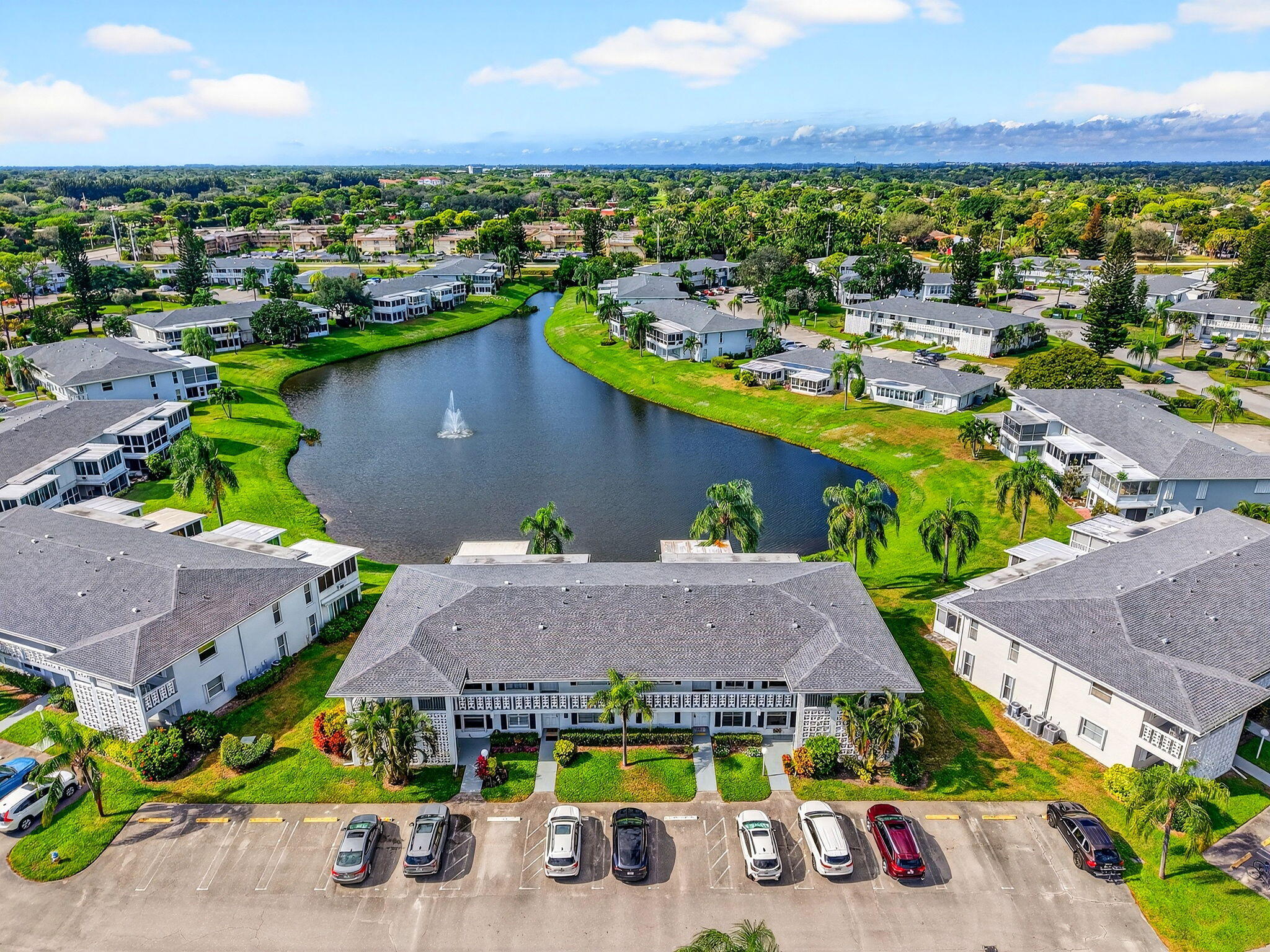 1411 Southwest 27th Avenue, Unit 201 Delray Beach, FL 33445 - Photo 27 of 48 an aerial view of houses with yard