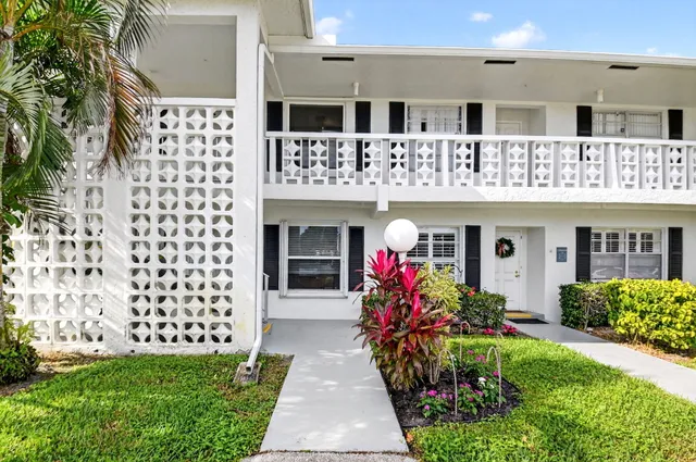 a bed room with furniture and a chandelier