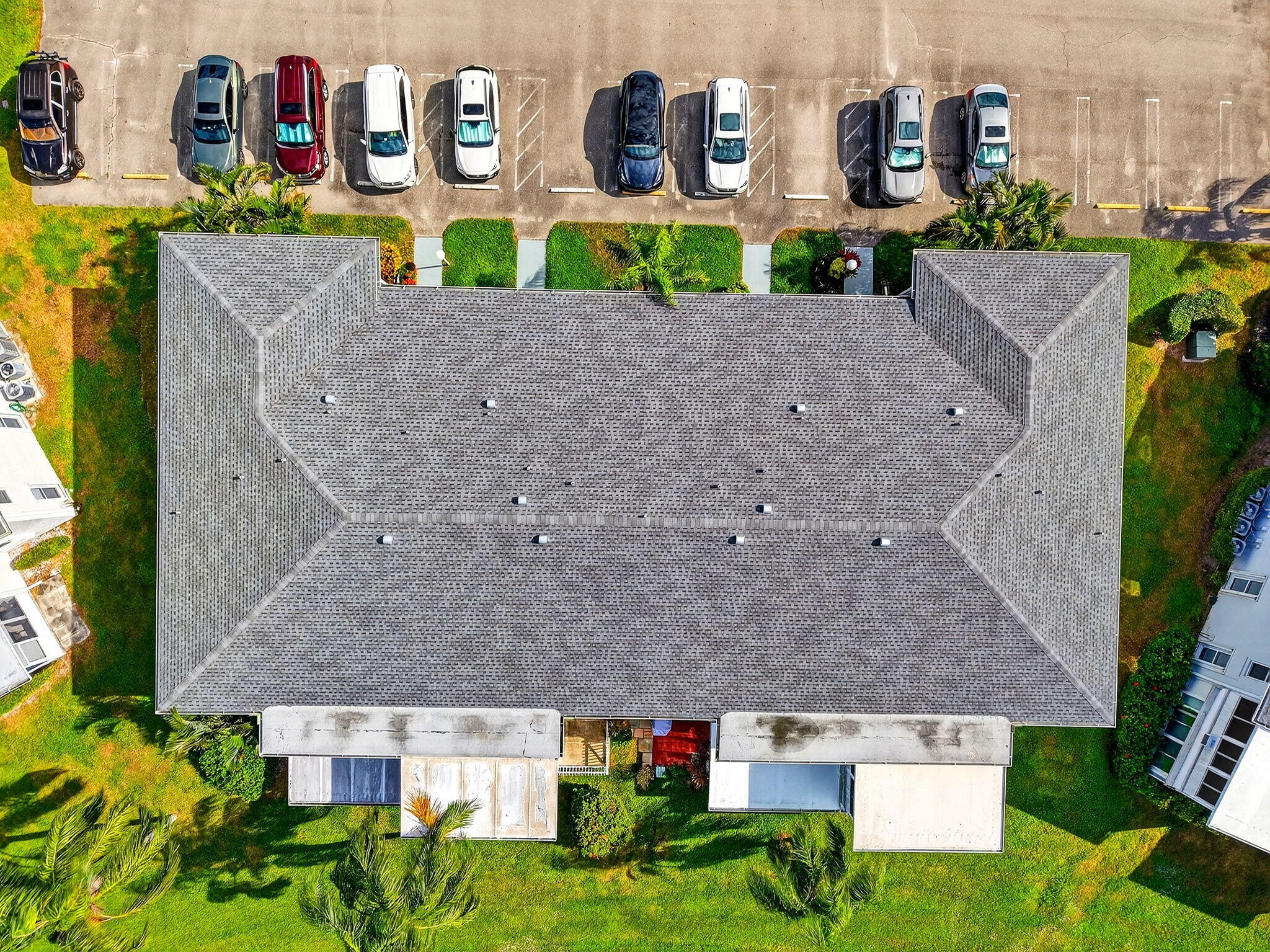 1411 Southwest 27th Avenue, Unit 201 Delray Beach, FL 33445 - Photo 36 of 48 an aerial view of multiple houses with a yard
