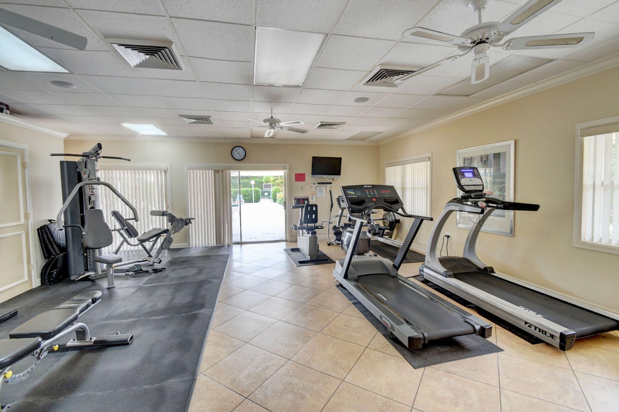 1411 Southwest 27th Avenue, Unit 201 Delray Beach, FL 33445 - Photo 41 of 48 a view of a room with gym equipment