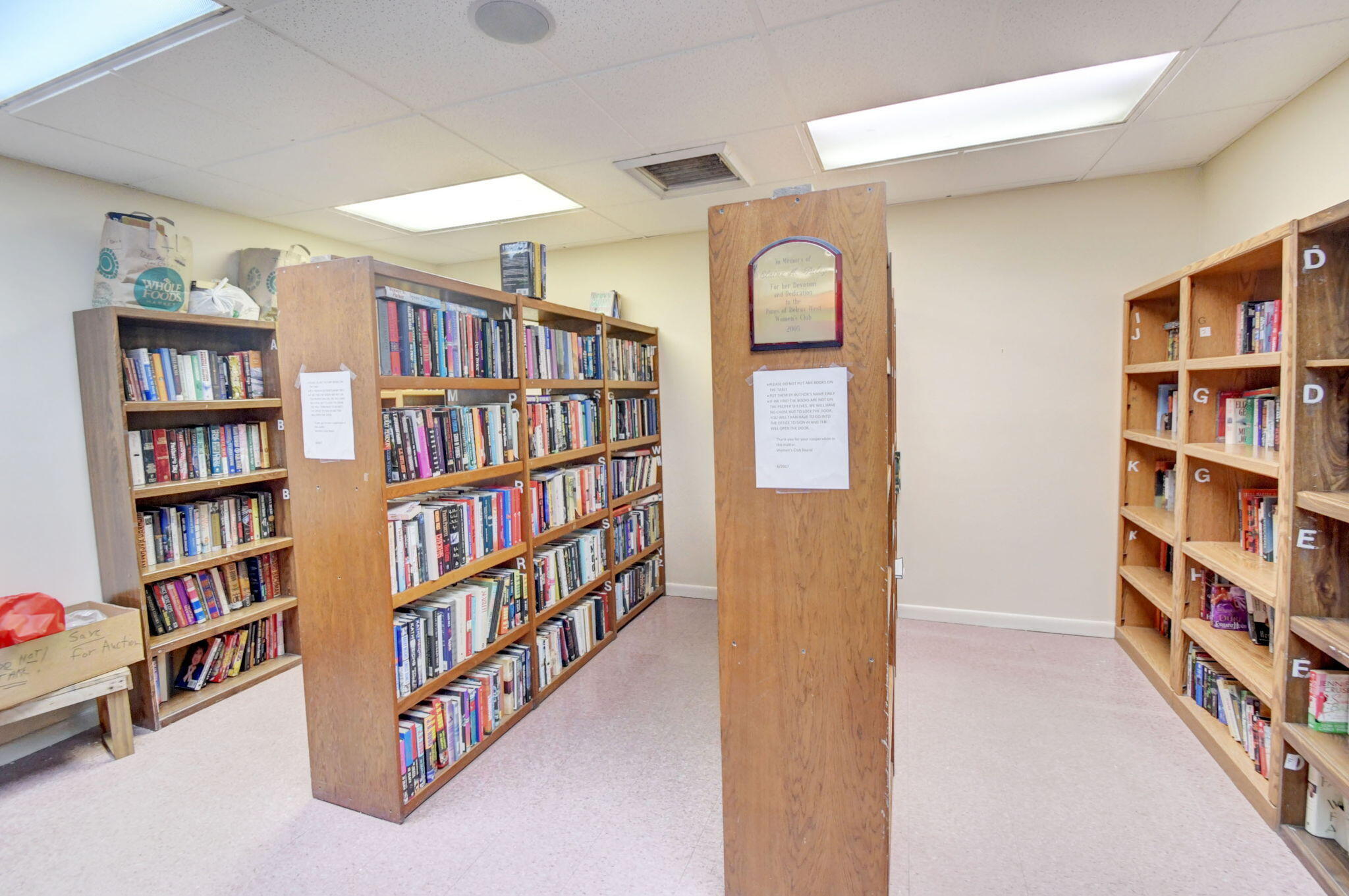 1411 Southwest 27th Avenue, Unit 201 Delray Beach, FL 33445 - Photo 43 of 48 a view of room with windows book shelves