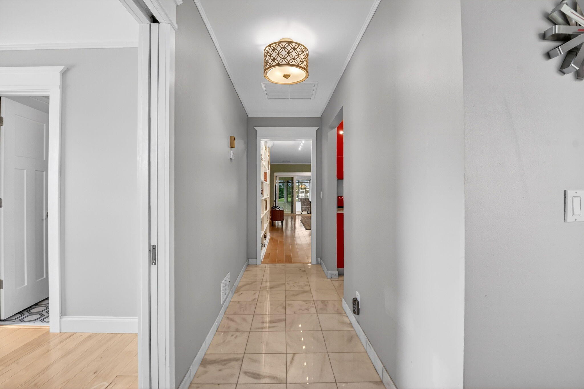 1411 Southwest 27th Avenue, Unit 201 Delray Beach, FL 33445 - Photo 5 of 48 a view of a hallway to a bedroom