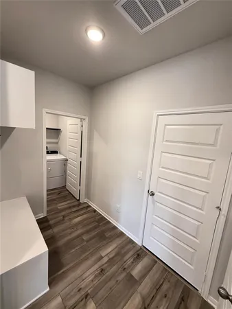 a bedroom with a bed and cabinets